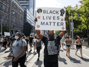 Protesters participate in an anti-racism march in Toronto on June 6.