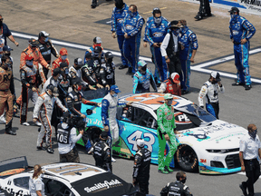Fellow drivers push the car of NASCAR Cup Series driver Bubba Wallace before the start of the Geico 500 at Talladega Superspeedway to show solidarity after a noose was found in his garage, Jun 22, 2020.