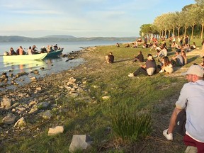 Blues musicians perform on small fishing boats on Lake Trasimeno to ensure social distancing during a concert that would usually be on a stage on land, after Italy eased more of its coronavirus disease (COVID-19) restrictions, in Lake Trasimeno, Italy, June 21, 2020.