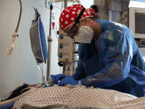 A doctor cares for an elderly patient with COVID-19 on June 18, 2020 in Santiago, Chile. While there are reports in some places that COVID-19 appears to be weakening, in other places it appears as potent as ever.