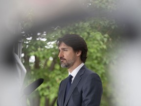 Prime Minister Justin Trudeau responds to a question during a news conference outside Rideau Cottage in Ottawa, Thursday, June 25, 2020. Trudeau says Canadian companies are now producing so much personal protective equipment needed in the fight against COVID-19 that Canada is almost at the point of being self-sufficient.