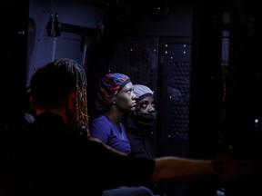 Demonstrators are seen detained inside a police vehicle during a protest against the death in Minneapolis police custody of George Floyd,  after curfew in the Manhattan borough of New York City, U.S., June 2, 2020.