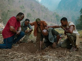 From left, Isiah Whitlock Jr., Norm Lewis, Clarke Peter, Delroy Lindo and Jonathan Majors in Da 5 Bloods.