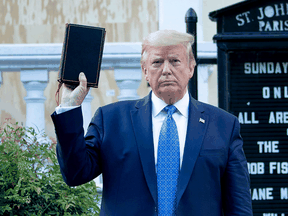 U.S. President Donald Trump holds a Bible while visiting St. John's Church across from the White House after the area was cleared of people protesting the death of George Floyd June 1, 2020.