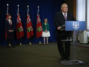 Premier Doug Ford, Minister of Education Stephen Lecce and Deputy Premier and Minister of Health Christine Elliott appear at a press briefing earlier this month. The trio did not appear at Wednesday's briefing after it was discovered Lecce had been in close contact with someone who had tested positive for COVID-19. All three government officials are now being tested for COVID.