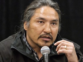 Chief Allan Adam of the Athabasca Chipewyan First Nation speaks during a press conference in Fort McMurray, Alta. on Friday May 30, 2014. New video has emerged of the violent arrest of a prominent chief of a northern Alberta First Nation. The Athabasca Chipewyan First Nation says the RCMP dash-camera video was released publicly as part of a court application to get criminal charges against Chief Allan Adam stayed.