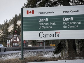 The Banff National Park entrance is shown as Parks Canada is restricting vehicles in the national parks and national historic sites in Banff, Alta., Tuesday, March 24, 2020. The federal environment minister says Canadians who have campground reservations in some national parks will be allowed to pitch their tents and pull in their trailers starting next week.