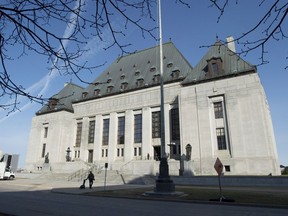 The Supreme Court of Canada is seen Friday April 25, 2014 in Ottawa. The Supreme of Court of Canada has sided with a man who was convicted of failing to comply with police checks while out on bail.