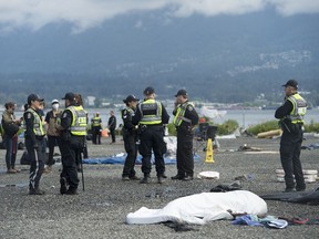 Police are on the scene as campers are asked to leave property owned by the Port of Vancouver next to Crab Park in downtown Vancouver, Tuesday, June 16, 2020.