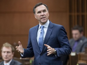 Finance Minister Bill Morneau rises during Question Period in the House of Commons Tuesday May 26, 2020 in Ottawa. The Canadian Association of Petroleum Producers says if bridge loans for smaller oil and gas companies aren't ready to flow soon some companies will have to turn to less-safe options to survive the COVID-19 slowdown.THE CANADIAN PRESS/Adrian Wyld