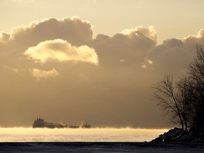 A cargo ship sits in the steaming fog of Lake Ontario in Toronto on Wednesday December 27, 2017. Regulators in the United States have launched a formal investigation into Canada's plan to change the rules that govern shipping on the Great Lakes.THE CANADIAN PRESS/Frank Gunn