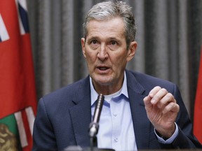 Manitoba Premier Brian Pallister speaks and answers questions during a COVID-19 press conference at the Manitoba legislature in Winnipeg Thursday, March 26, 2020. The Manitoba government is expanding a program that will incentivize businesses impacted by COVID-19 to bring back employees as restrictions are lifted.