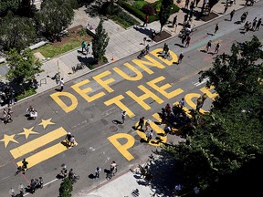 "Defund the Police" reads the mantra painted on a street near the White House in Washington, U.S., June 7, 2020.