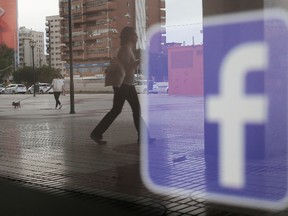 Facebook logo is seen on a shop window in Malaga, Spain, June 4, 2018.