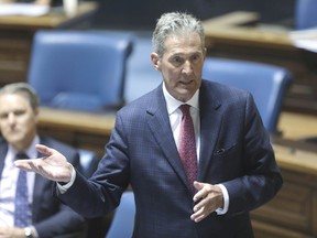 Premier Brian Pallister responds to questions from Manitoba opposition NDP Leader Wab Kinew during question and answer period at the Legislative Building in Winnipeg, Wednesday, May 20, 2020.