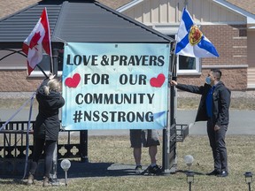 Three Nova Scotia senators are renewing their call for the province to join with Ottawa to launch a joint inquiry into the mass shooting in April that claimed the lives of 22 people. Workers at an extended care facility show their community support in Debert, N.S. on Tuesday, April 21, 2020.