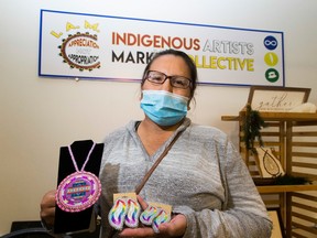 Monica Rain with some of her work at the Farmers Market during Indigenous People's Day on Sunday, June 21, 2020 in Edmonton.