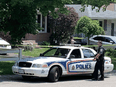 Police investigate a fatal home shooting in London, Ont., on June 22, 2020.