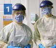 Dr. Jane Philpott, left, with a colleague at the COVID-19 assessment centre at the Markham Stouffville Hospital in Ontario, in an undated photo.