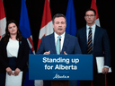 Alberta Premier Jason Kenney, with MLA Michaela Glasgo and Justice Minister Doug Schweitzer, announces new initiatives to improve firearms governance and enforcement, in Edmonton on June 3, 2020.