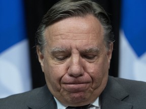 Quebec Premier Francois Legault pauses as he announces the reaching of over 5000 victims of the Covid-19 virus in the province, during a news conference on the COVID-19 pandemic, Tuesday, June 9, 2020 at the legislature in Quebec City.