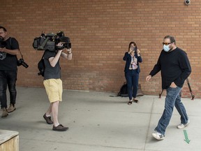 Andrij Olesiuk, who was found guilty of charges including fraud under $5,000 and possession of property obtained by crime enters after he defrauded thousands of dollars from Humboldt Broncos GoFundMe donors, enters Saskatoon Provincial Court for his sentencing hearing in Saskatoon, Tuesday, June 23, 2020.