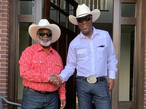 CounselQuest CEO Lloyd Wilks, right, and his father, Clovis Earl Wilks of Pickering, Ont., pose for a photograph on July 13, 2019, on their way to the Calgary Stampede.