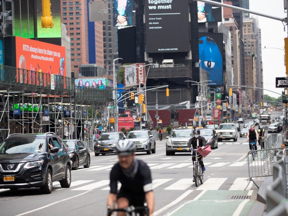 traffic moves through times square in new york, u.s., on thursday, june 11, 2020. new york streets got a little more congested this week as the city entered phase 1 of its re-opening from the coronavirus-imposed lockdown.