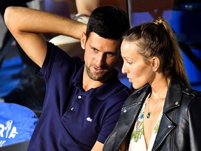 Serbian tennis player Novak Djokovic, left, talks to his wife Jelena during a match at the Adria Tour in Belgrade on June 14, 2020.