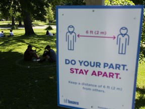 People use their smart phones during the COVID-19 pandemic in Toronto on Thursday, June 18, 2020. The Government of Canada along with provinces have announced a new downloadable contact tracing app for COVID-19, which is optional for people to use.