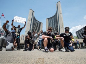 March For Change participants at Toronto City Hall protest in support and remembrance of George Floyd, who was killed by police in Minneapolis, on June 5.