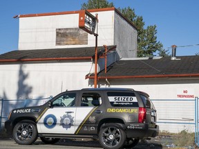 A vehicle belonging to the Combined Forces Special Enforcement Unit sits in front of the former Nanaimo Hells Angels clubhouse.