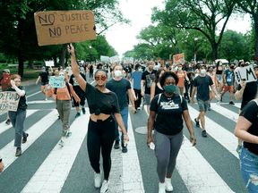 Protesters march against racial inequality in the aftermath of the death in Minneapolis police custody of George Floyd, in Washington, June 10, 2020.