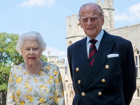 Britain's Queen Elizabeth II and Britain's Prince Philip, Duke of Edinburgh, pose in the quadrangle of Windsor Castle on June 6, 2020 in advance of Prince Philip's 99th birthday.