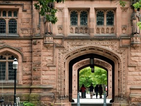 People walk on Princeton University campus in Princeton, New Jersey, U.S., on Friday, Aug. 30, 2013.