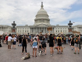 People attend a Black Lives Matter rally, as protests continue over the death in Minneapolis police custody of George Floyd, outside the U.S. Capitol in Washington, U.S., June 3, 2020.