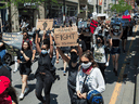 Protestors march during an anti-racism rally in Toronto on June 6, 2020.