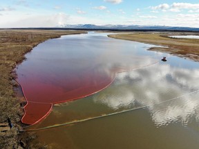 This handout photograph taken and released by the Marine Rescue Service of Russia on June 3, 2020, shows a large diesel spill in the Ambarnaya River outside Norilsk.