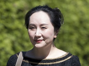 Meng Wanzhou, chief financial officer of Huawei, leaves her home to go to B.C. Supreme Court in Vancouver, Wednesday, May 27, 2020. Lawyers for Meng Wanzhou are alleging that Canada's national spy agency was in on a plan for border officers to detain the Huawei executive for hours before her arrest at Vancouver's airport and was mindful of the political implications of her arrest.