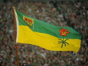 The Saskatchewan flag blows in the wind before the final Saskatchewan Roughriders game at Mosaic Stadium in Regina on Saturday, Oct. 29, 2016. The Saskatchewan government is extending services to youth who otherwise would be aging out of the foster care system.