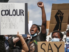 Protesters gather in solidarity with the George Floyd protests across the United States in Calgary, Alta., Wednesday, June 3, 2020. Demonstrators plan to march from Parliament Hill through Ottawa streets in mid-afternoon today to honour black lives lost at the hands of police.