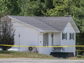 A house is surrounded by police tape where a man was shot on Friday night, near Miramichi, N.B. on Saturday, June 13, 2020. A section of route 425 was blocked to through traffic. The man fatally shot by New Brunswick RCMP Friday night has been identified by social media posts as Rodney Levi, 48, of the Metepenagiag First Nation.