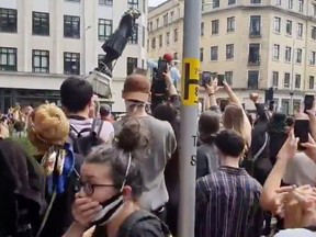 Protesters tear down a statue of Edward Colston during a protest against racial inequality in Bristol, Britain June 7, 2020 in this screen grab obtained from a social media video.