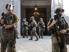 ational Guard troops are posted outside the District Attorney's office during a peaceful demonstration over George Floyds death on June 3, 2020 in Los Angeles, California.