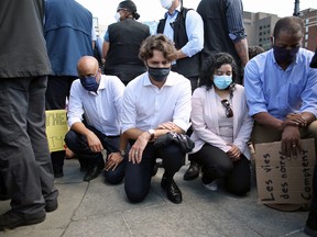 Prime Minister Justin Trudeau (2nd L) takes a knee during a Black Lives Matter protest on Parliament Hill June 5, 2020 in Ottawa, Canada.