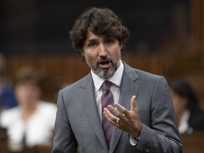 Canadian Prime Minister Justin Trudeau rises during a sitting of the Special Committee on the COVID-19 Pandemic in the House of Commons, in Ottawa, Wednesday, June 3, 2020.