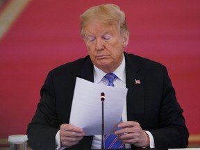 In this file photo taken on June 26, 2020 US President Donald Trump looks on during an American Workforce Policy Advisory Board Meeting in the East Room of the White House in Washington, DC.