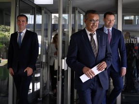 Tedros Adhanom Ghebreyesus, Director-general of the World Health Organization (WHO), flanked by Germany's Federal Minister of Health Jens Spahn and France's Minister for Solidarity and Health Olivier Veran, speaks during a news conference in Geneva, Switzerland, June 25, 2020.