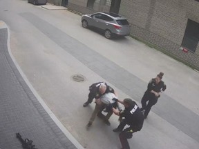 Winnipeg police are defending their actions and reaching out to Indigenous leaders after a video surfaced showing officers kneeing and kicking a man during an arrest. A framegrab from the video is shown in a handout. THE CANADIAN PRESS/HO-Winnipeg Police Service MANDATORY CREDIT