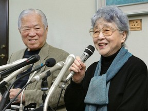 Shigeru Yokota (L) looks on as his wife Sakie (R) answers questions during a press conference in Kawasaki, a suburb of Tokyo, on March 17, 2014.
